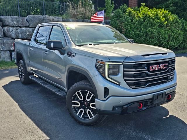 2024 GMC Sierra 1500 AT4 in Sterling Metallic — front three-quarter view